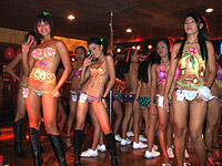 Bar girls dancing at Pony Tails Club on Walking Street, Angeles City.